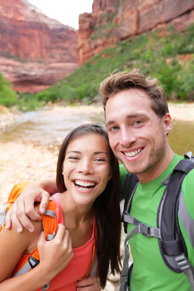 A young couple hiking in Zion National Park